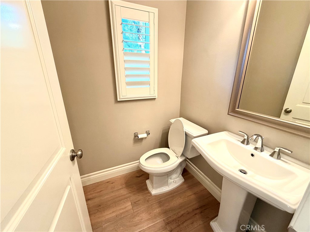 56 Strawberry Grove Irvine, CA 92620 - Photo 5 of 24 a bathroom with a sink and a toilet