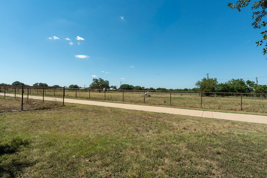 3550 County Road 245 Florence, TX 76527 - Photo 15 of 38 Pipe Fencing surrounds about 6 fenced pastures. Many Majestic Oak trees offer natural shade and a Beautiful Landscape.