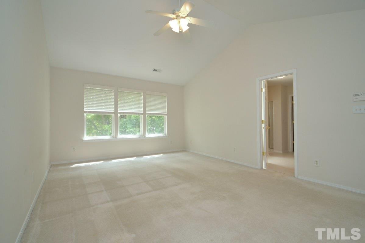 8303 Rubblestone Path Raleigh, NC 27613 - Photo 16 of 25 an empty room with windows and closet