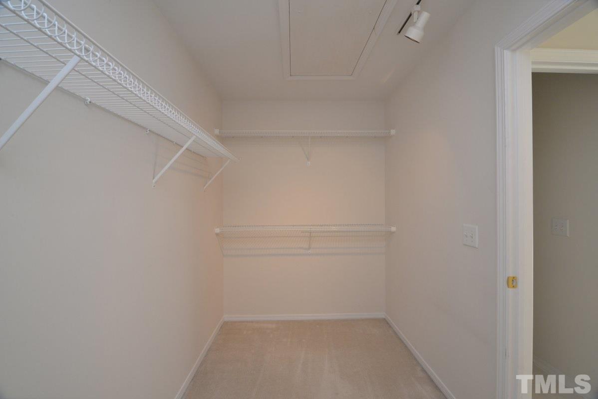 8303 Rubblestone Path Raleigh, NC 27613 - Photo 19 of 25 a view of an empty walk in closet