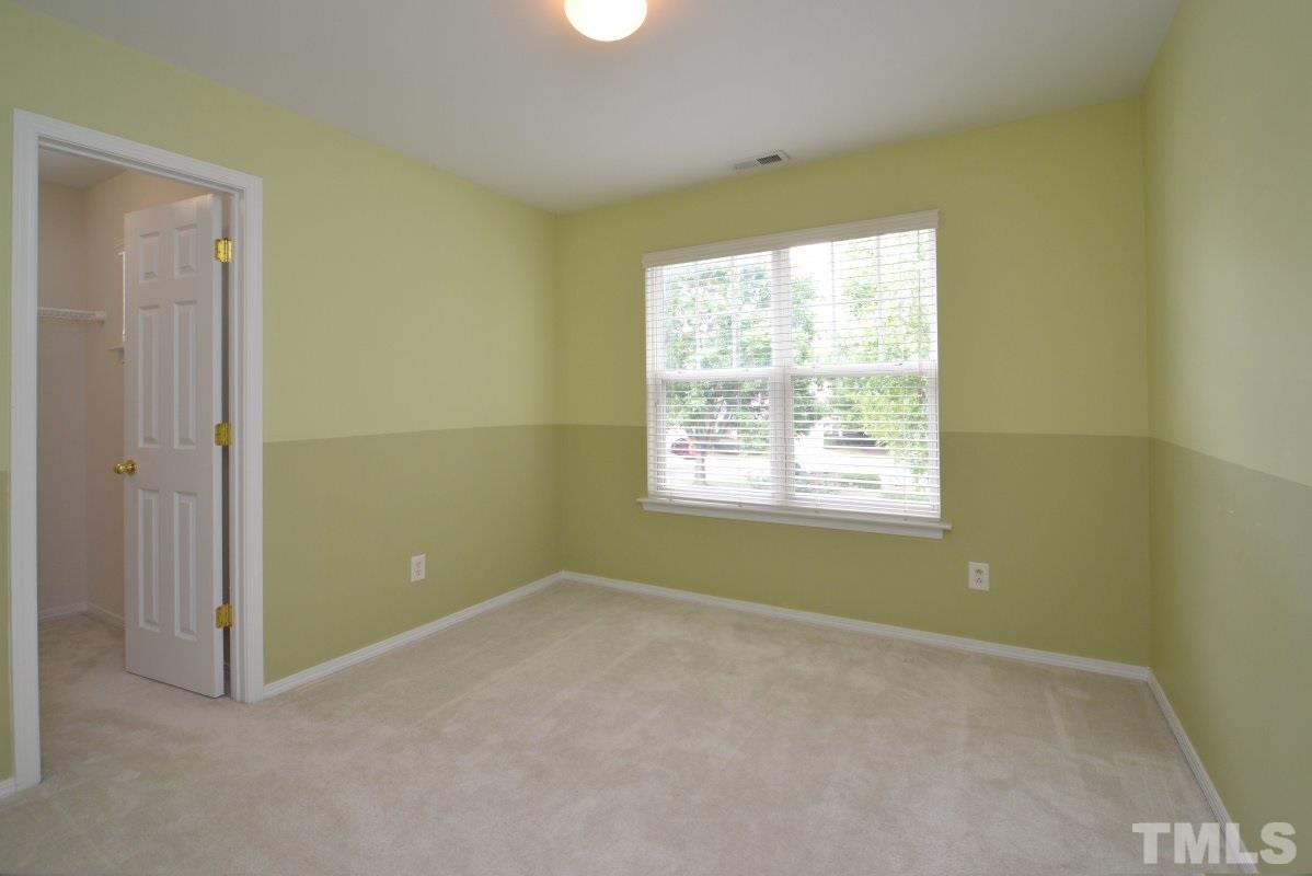 8303 Rubblestone Path Raleigh, NC 27613 - Photo 20 of 25 a view of an empty room with a window