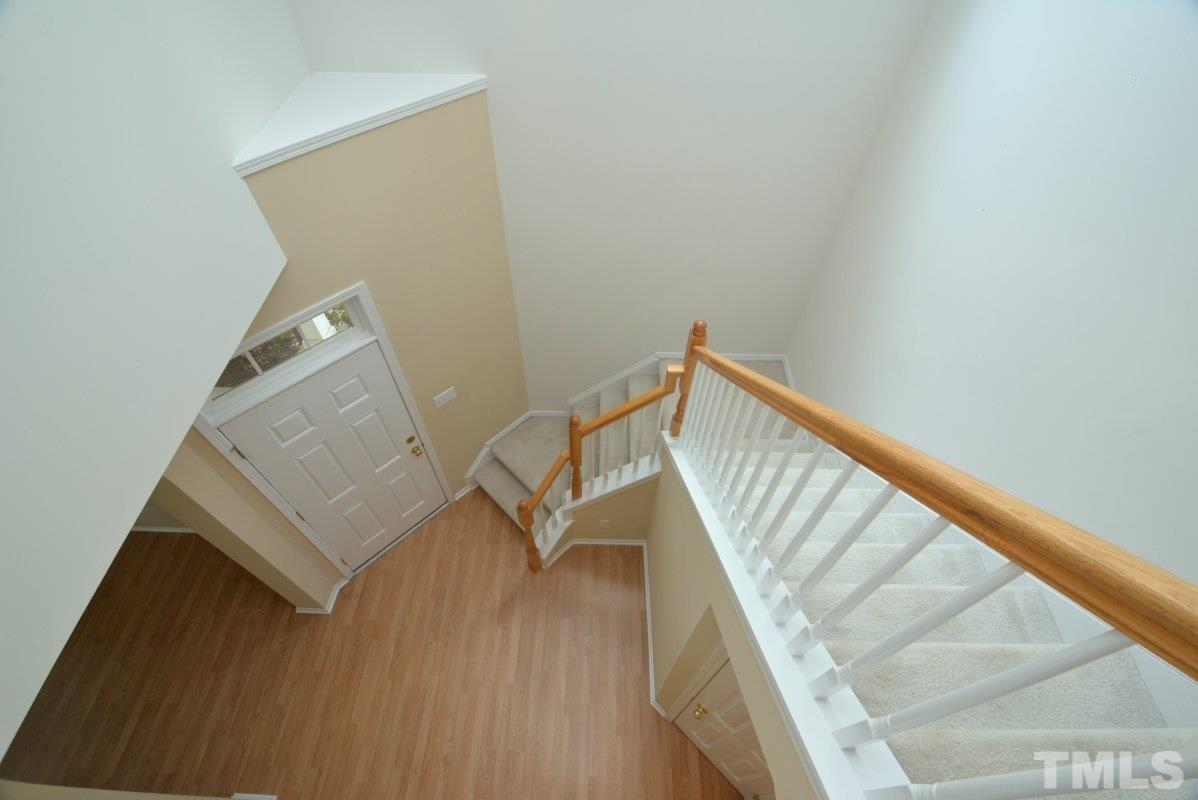 8303 Rubblestone Path Raleigh, NC 27613 - Photo 4 of 25 a view of entryway with wooden floor