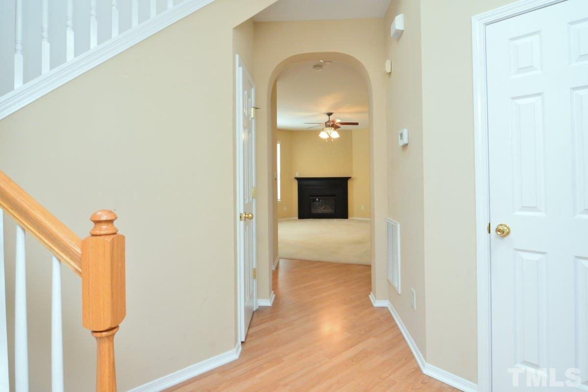 8303 Rubblestone Path Raleigh, NC 27613 - Photo 6 of 25 a view of a bedroom from the hallway
