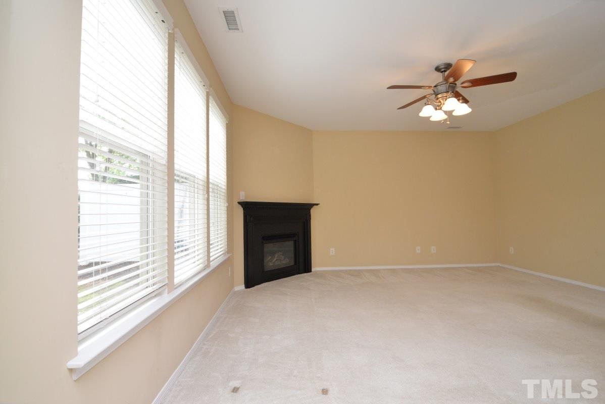 8303 Rubblestone Path Raleigh, NC 27613 - Photo 9 of 25 a view of an empty room with a window