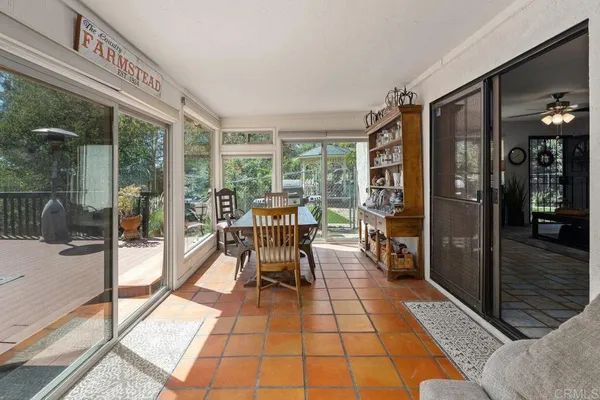 a very nice looking room with a large window and furniture