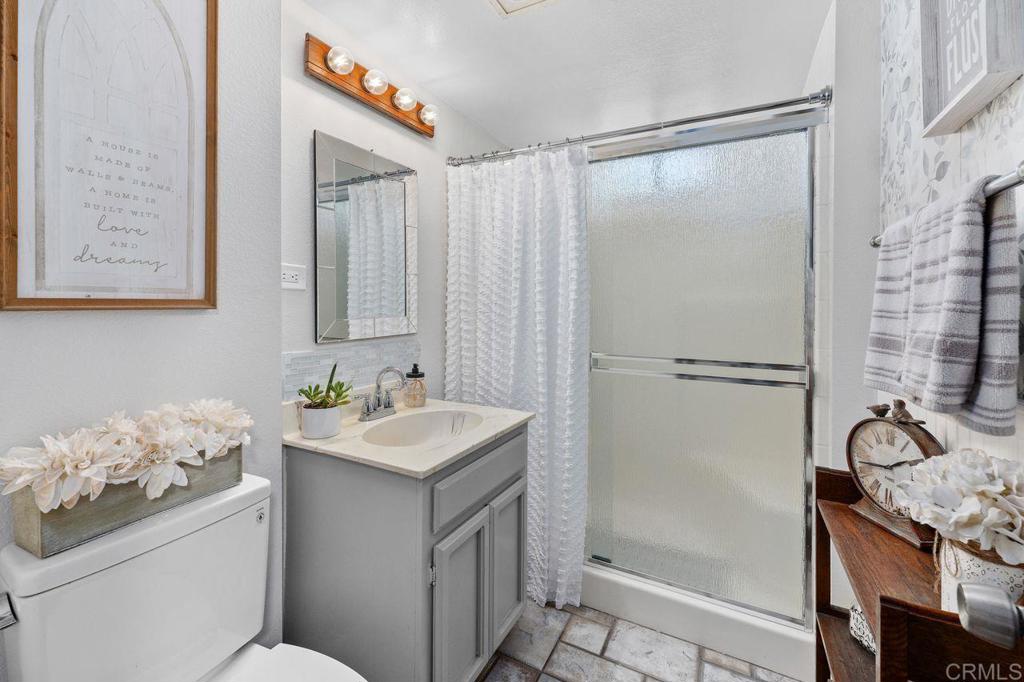 2869 Polk Road Alpine, CA 91901 - Photo 14 of 36 a bathroom with a sink toilet and shower