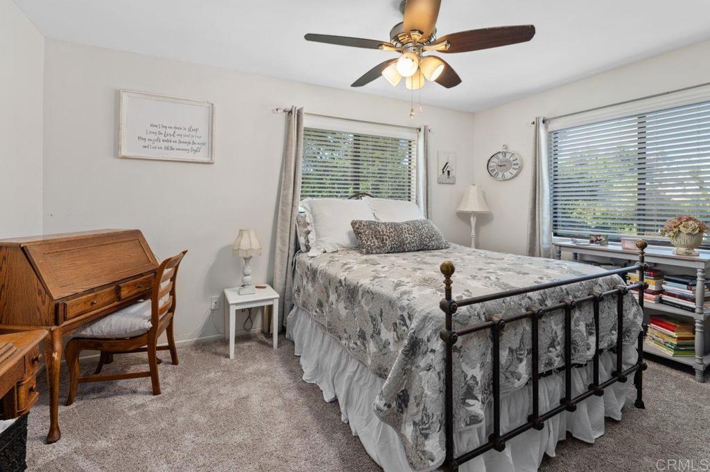 2869 Polk Road Alpine, CA 91901 - Photo 17 of 36 a bedroom with a bed a table and chair