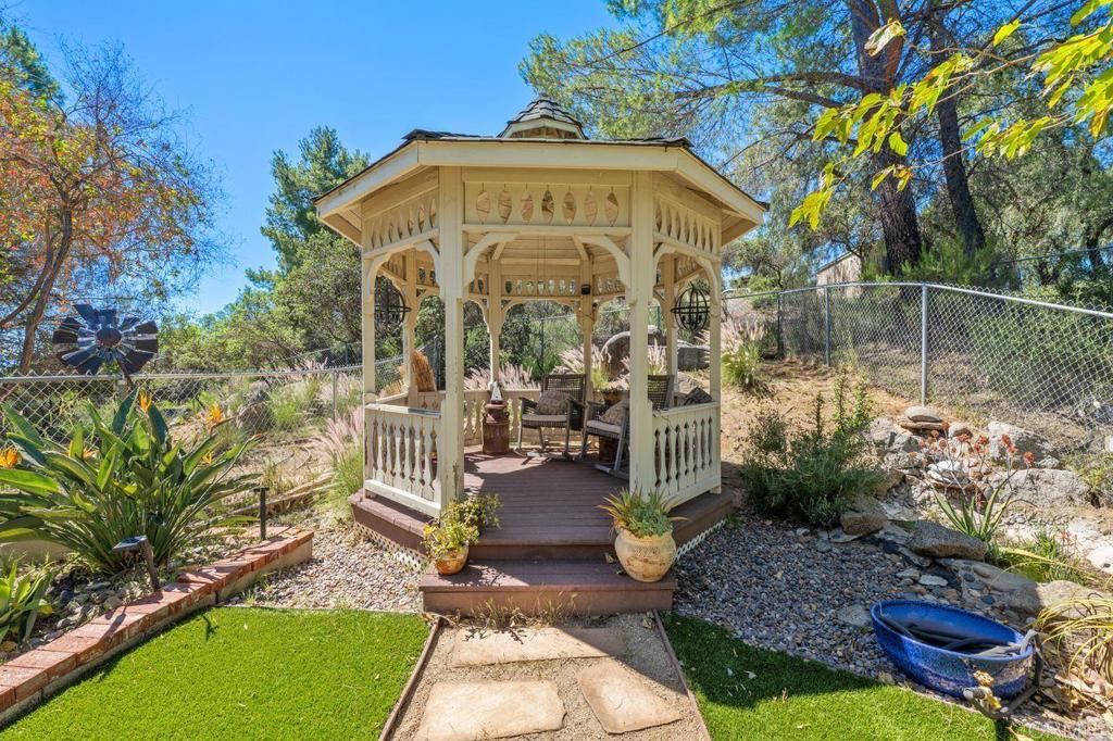 2869 Polk Road Alpine, CA 91901 - Photo 5 of 36 a view of a big yard with large trees and flower plants