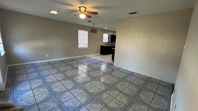 a view of empty room with windows