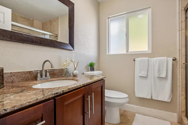 a bedroom with a large bed and a large window