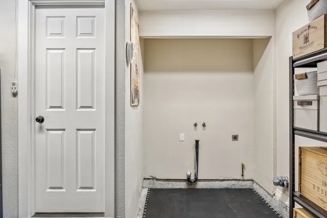 a view of a patio with a dining table and chairs with wooden floor