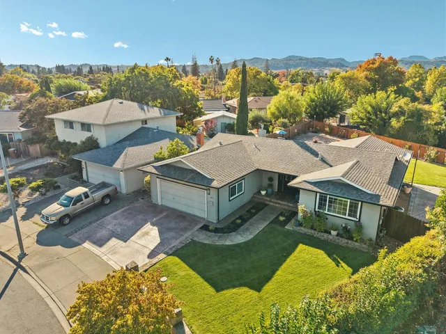 an aerial view of residential houses with outdoor space