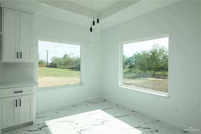 a view of a room that has a window in it