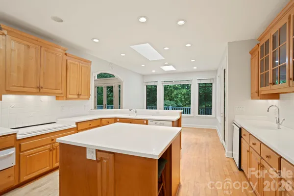 a kitchen with a sink and large window