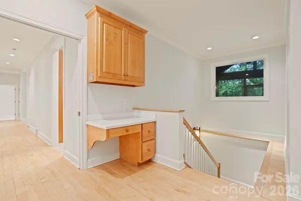 a view of room with window and refrigerator