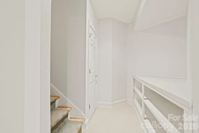 a bathroom with a sink a toilet and a large mirror