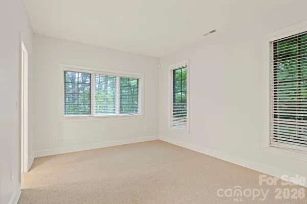a view of a balcony with wooden floor