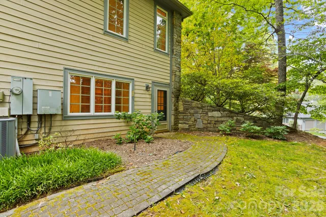 a front view of a house with a yard and a garage