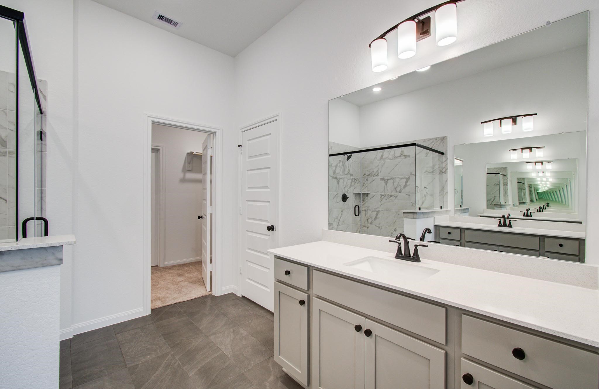7231 Yarrow Blossom Court Katy, TX 77493 - Photo 28 of 49 a bathroom with a sink and a mirror