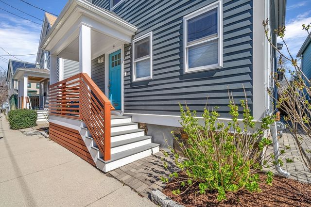 a view of stairs and bench with wooden floor