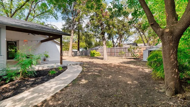 a view of a trees in front of a house