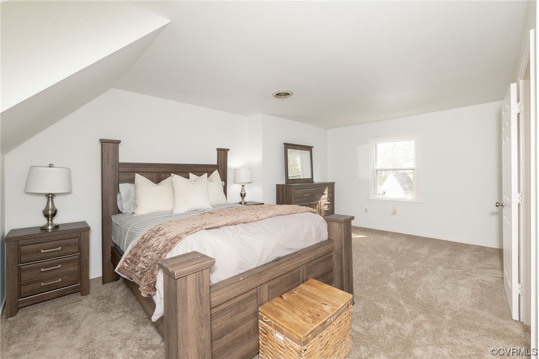 2617 Iverson Road Midlothian, VA 23112 - Photo 20 of 32 a bed sitting in a bedroom next to a window