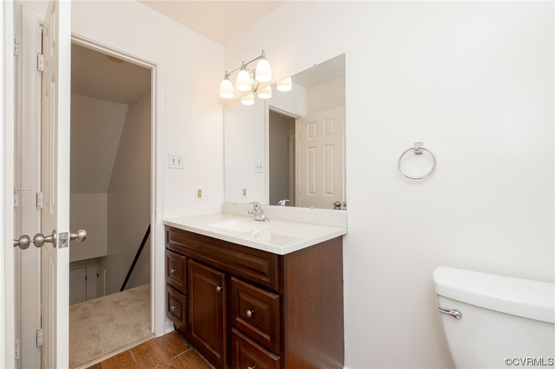 2617 Iverson Road Midlothian, VA 23112 - Photo 21 of 32 a bathroom with a sink a toilet and a mirror