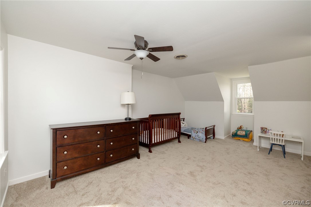 2617 Iverson Road Midlothian, VA 23112 - Photo 23 of 32 a room with a dresser and a chandelier