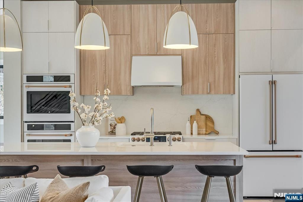 36 James Street Montclair, NJ 07042 - Photo 11 of 48 a kitchen with stainless steel appliances a sink and cabinets