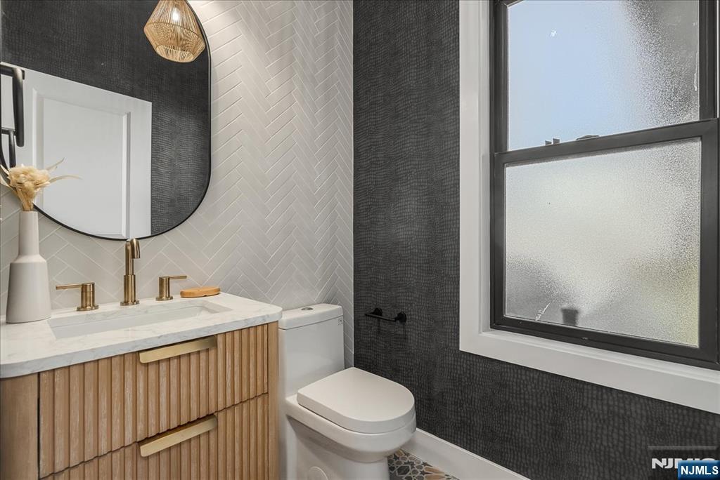 36 James Street Montclair, NJ 07042 - Photo 17 of 48 a bathroom with a toilet a sink and mirror