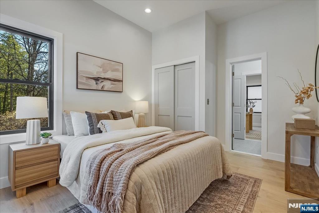 36 James Street Montclair, NJ 07042 - Photo 18 of 48 a bedroom with bed and a night stand