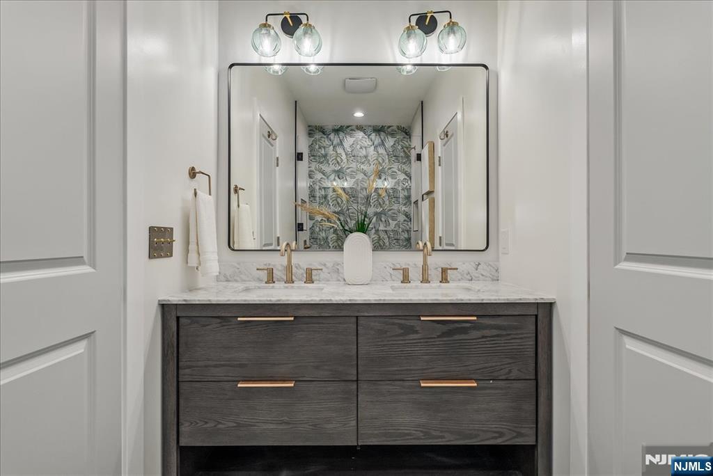 36 James Street Montclair, NJ 07042 - Photo 19 of 48 a bathroom with a sink and a mirror