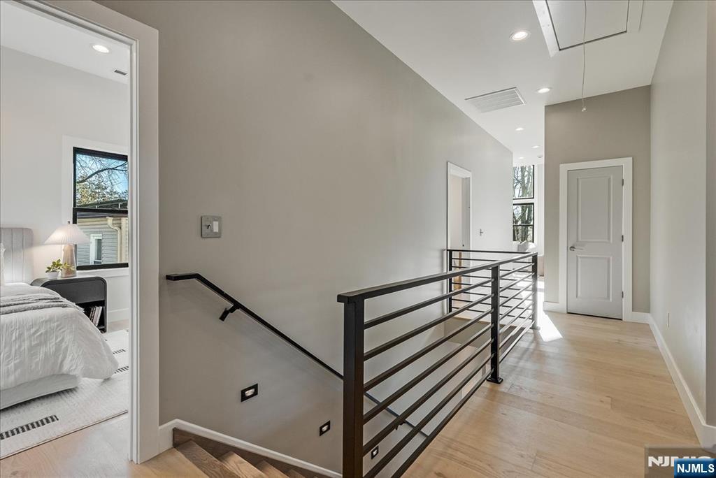 36 James Street Montclair, NJ 07042 - Photo 21 of 48 a view of a hallway with bedroom and wooden floor