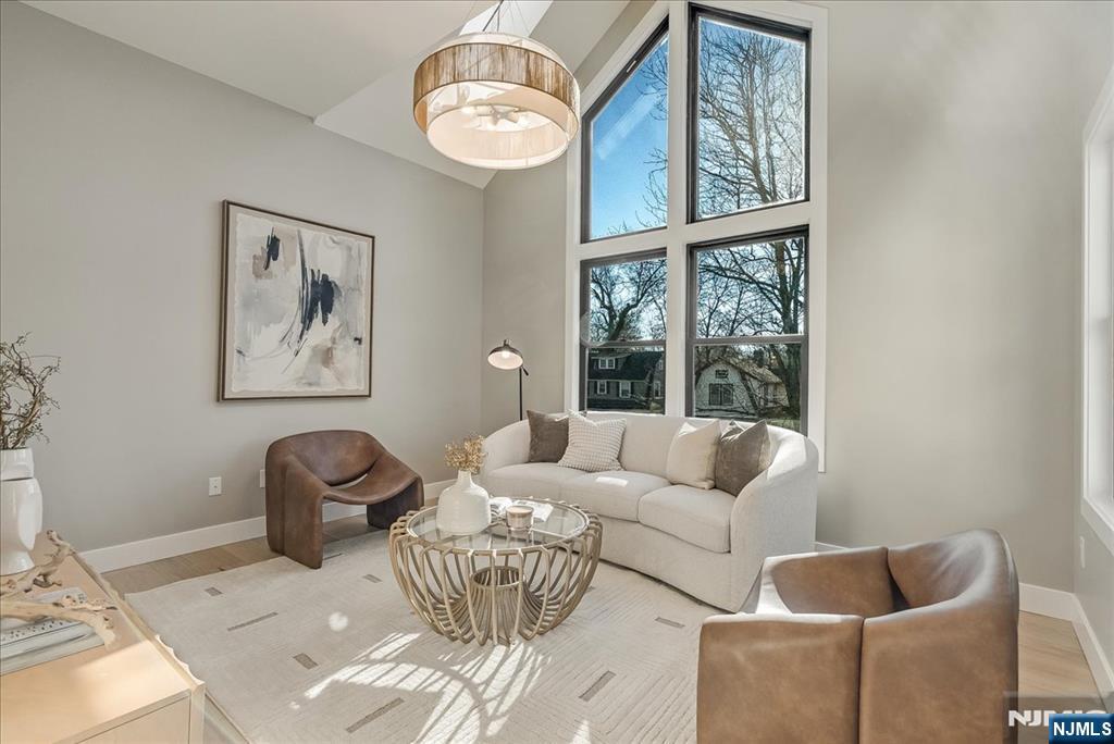 36 James Street Montclair, NJ 07042 - Photo 22 of 48 a living room with furniture and a large window