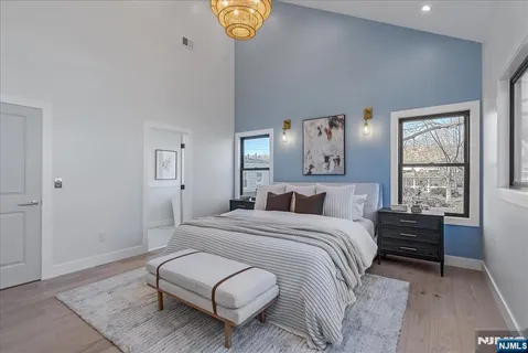 a bedroom with a bed couch and window