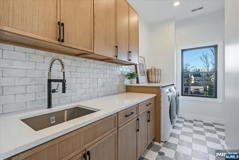a kitchen with appliances cabinets and a sink