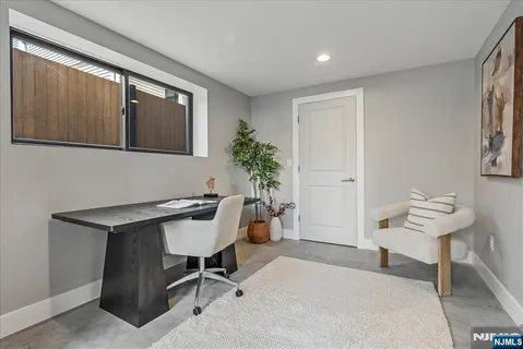 a workspace with furniture and window