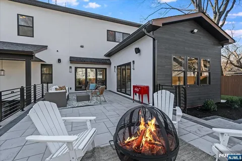 a view of a livingroom with furniture and staircase