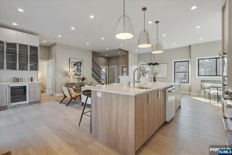 an open kitchen with a table and chairs in it