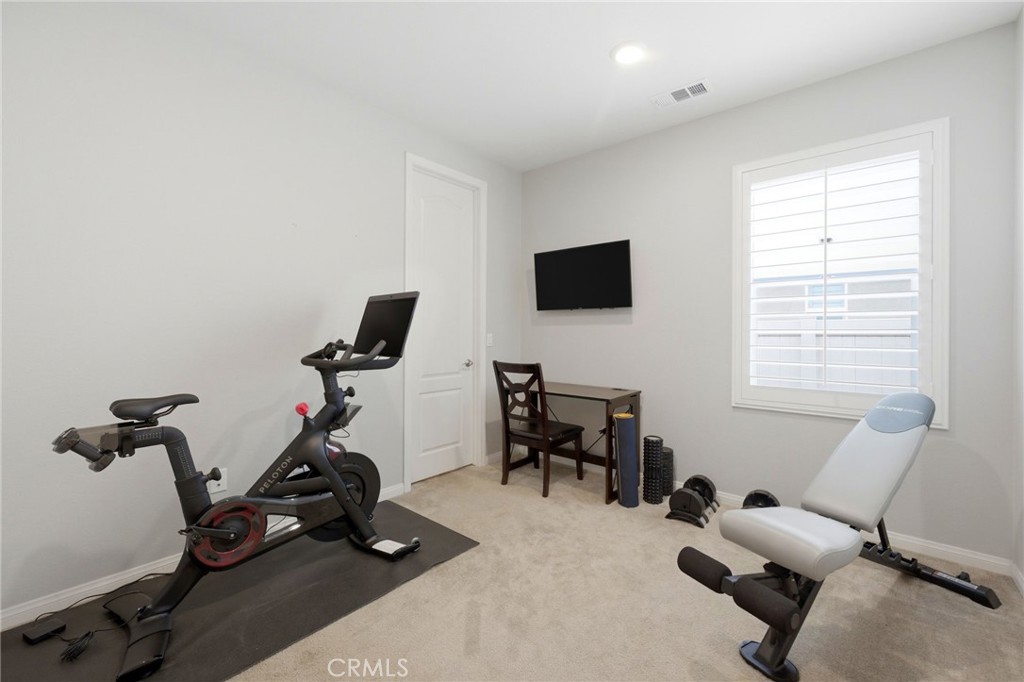 20948 Center Street Riverside, CA 92507 - Photo 44 of 92 a view of a workspace with furniture and a window