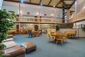 5829 East Buck Springs Road, Unit 201 Pinetop, AZ 85935 - Photo 14 of 23 a view of a terrace with seating area and furniture