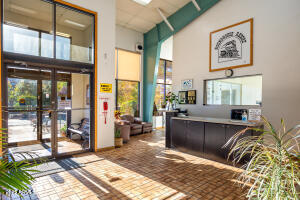 5829 East Buck Springs Road, Unit 201 Pinetop, AZ 85935 - Photo 17 of 23 a living room with furniture and large windows