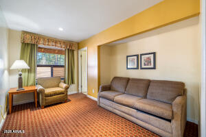 5829 East Buck Springs Road, Unit 201 Pinetop, AZ 85935 - Photo 3 of 23 a living room with furniture and a large window