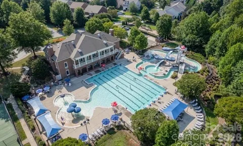 a view of a swimming pool with chairs