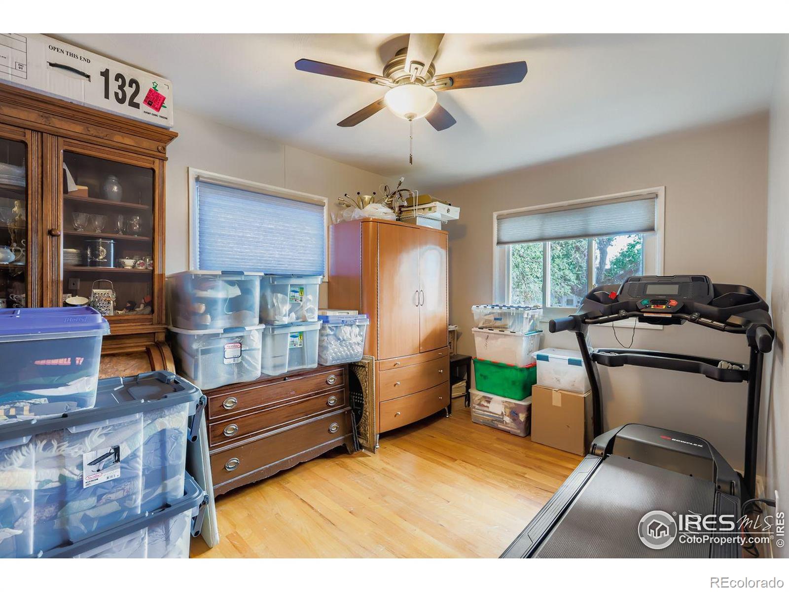 2431 West 24th Street Greeley, CO 80634 - Photo 16 of 32 a living room with furniture and a chandelier