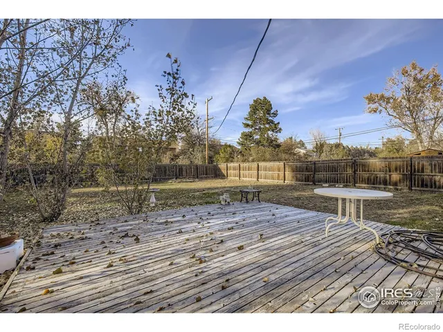 a view of house with backyard and wooden floor