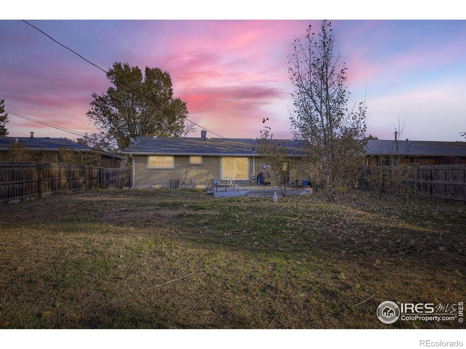 2431 West 24th Street Greeley, CO 80634 - Photo 32 of 32 a view of a house with a yard