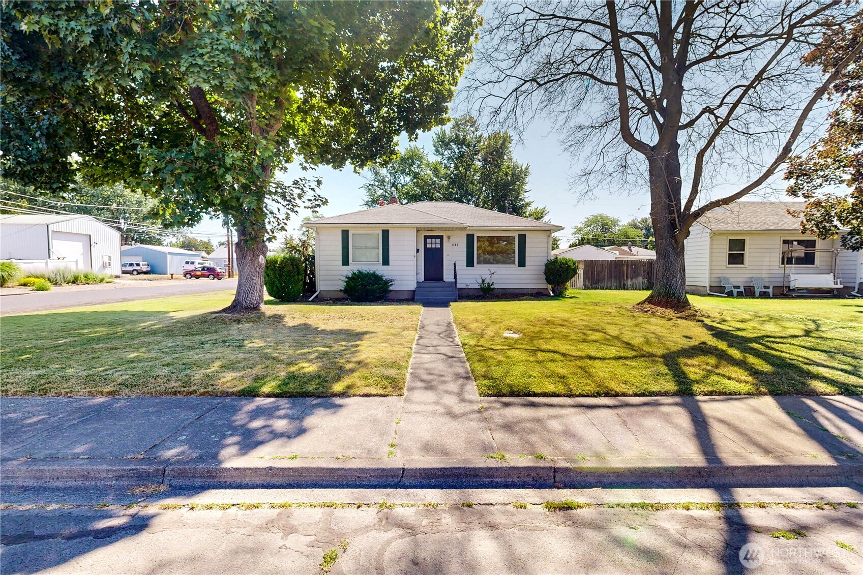 a view of house with yard