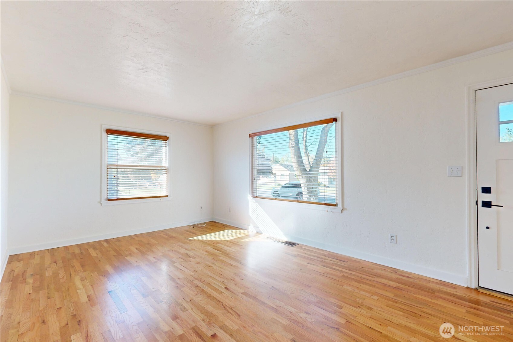 1303 Modoc Street Walla Walla, WA 99362 - Photo 14 of 40 a view of an empty room with wooden floor and a window