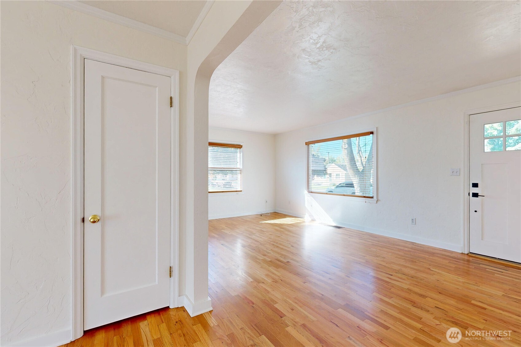 1303 Modoc Street Walla Walla, WA 99362 - Photo 17 of 40 an empty room with wooden floor and windows
